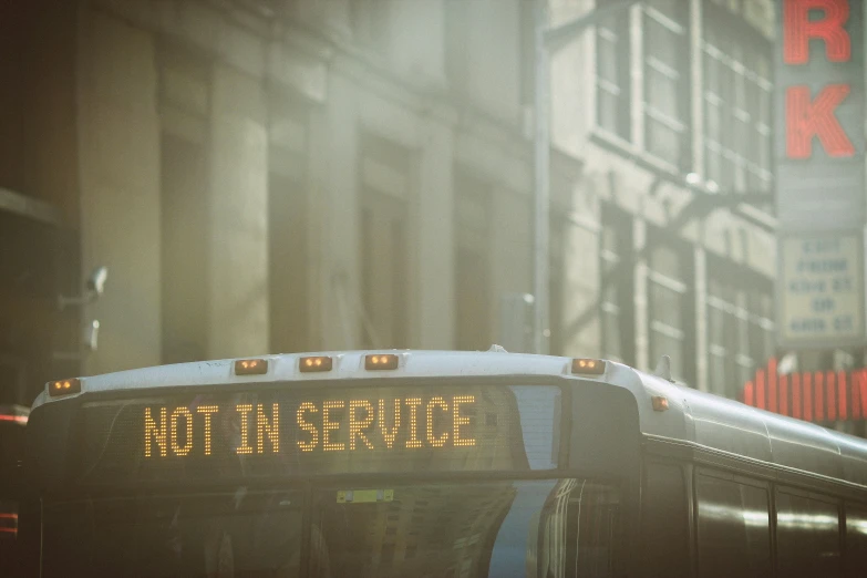 the back of a bus on the street in the city