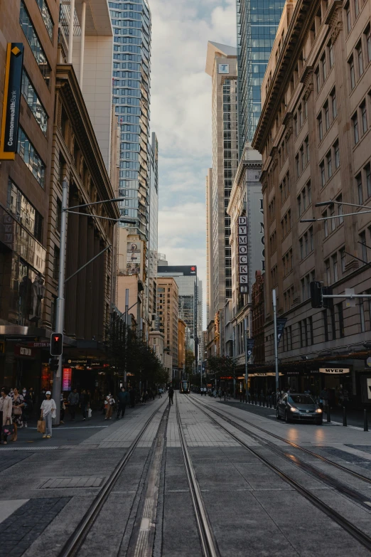 an empty street surrounded by tall buildings