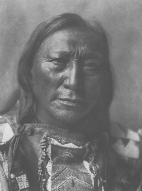 the old pograph shows the facial and expression of an native man