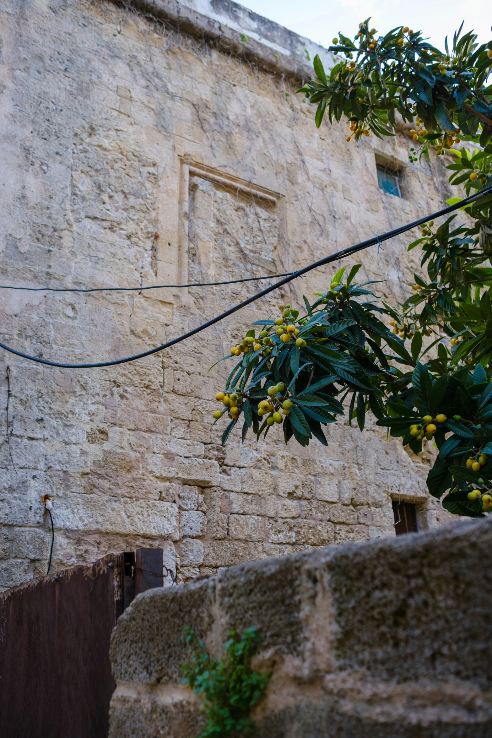 a couple of stone buildings with doors and window