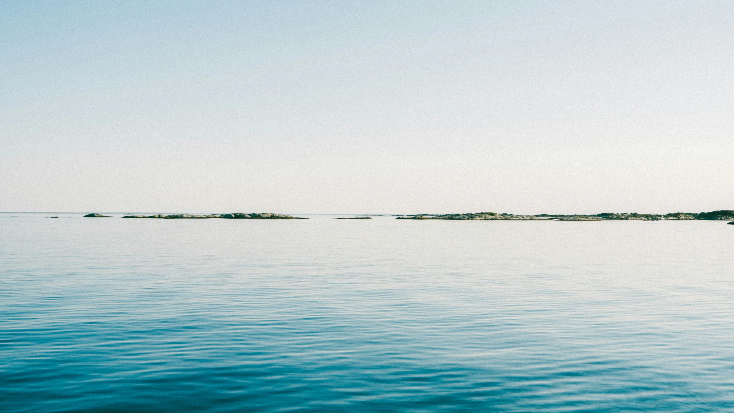 water with a few small island in the distance