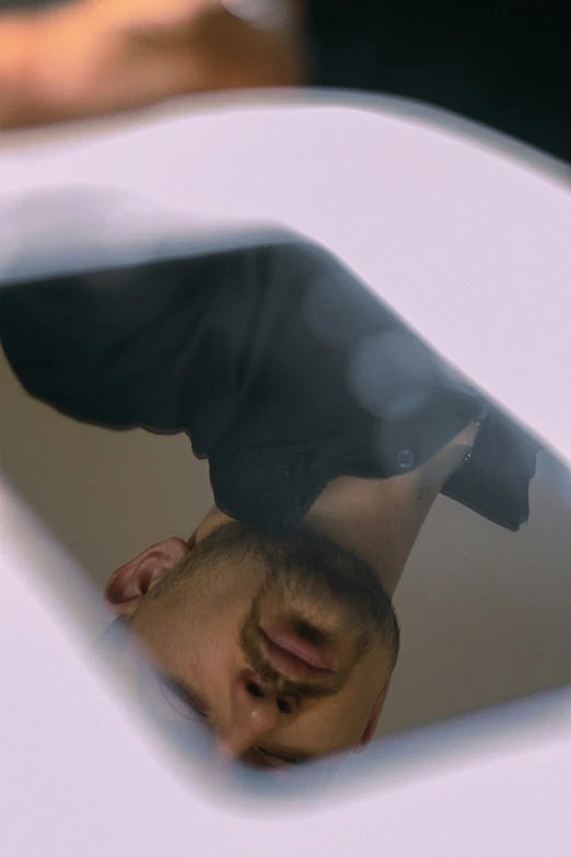 a reflection of a person with his skateboard