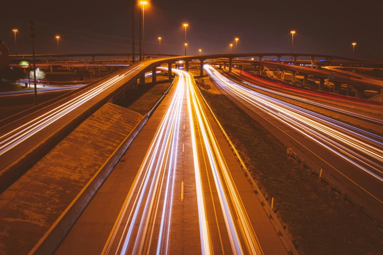 multiple lights and traffic lines on the street at night