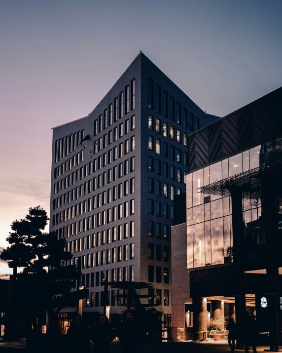 a building at night in the middle of the city