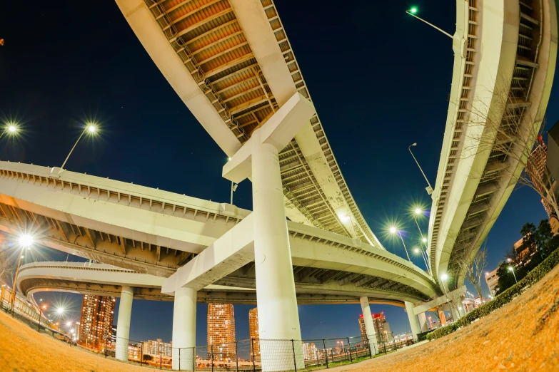 a bridge going over a highway next to an area that is under construction