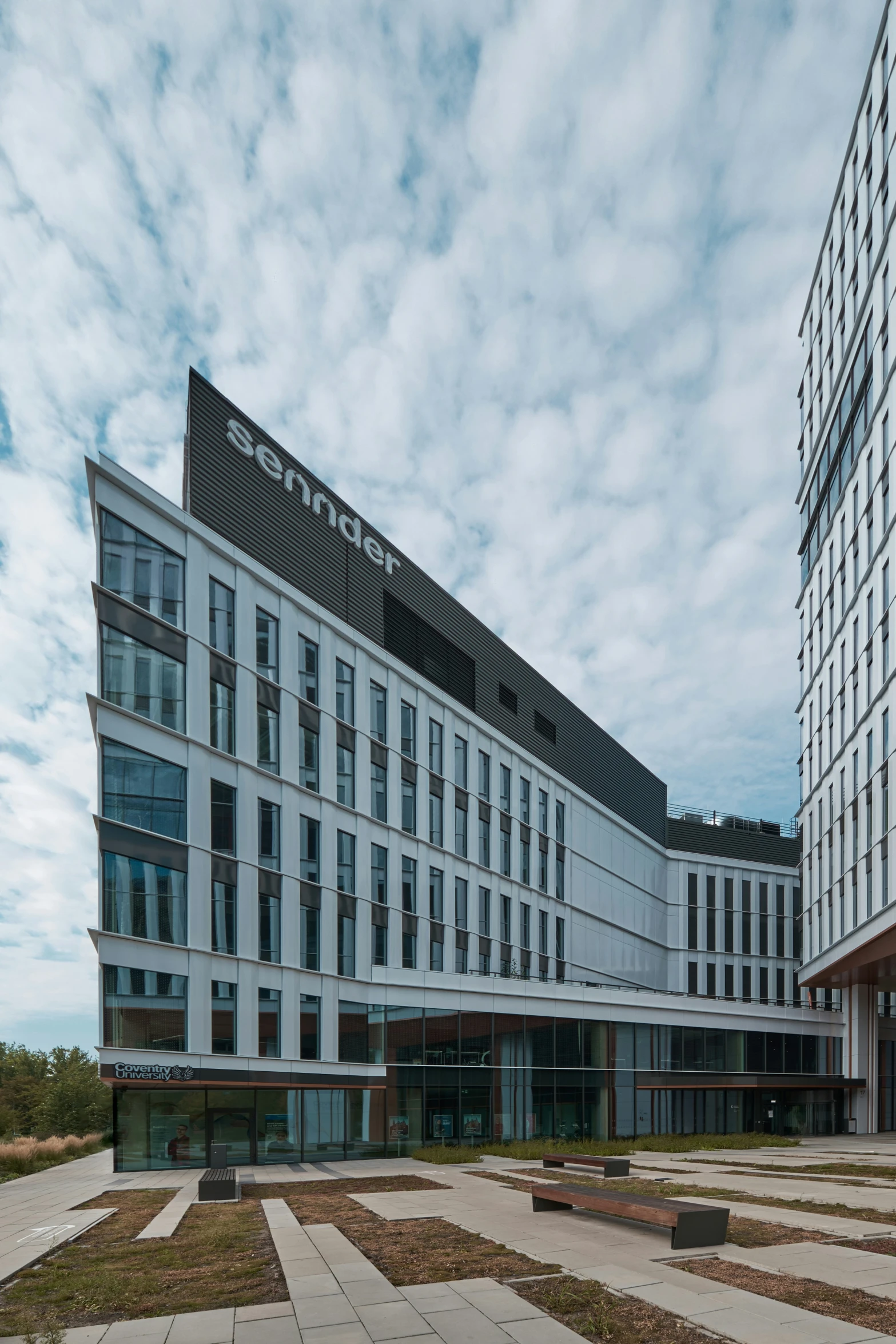 a building with an office space on the ground and windows on top of it