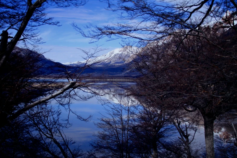 view from across the water looking toward a snowy mountain range