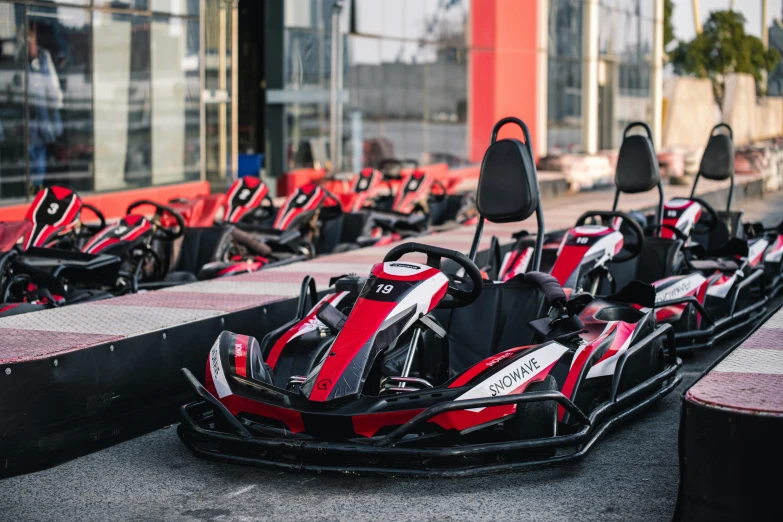 red and black go kart racing going down the track