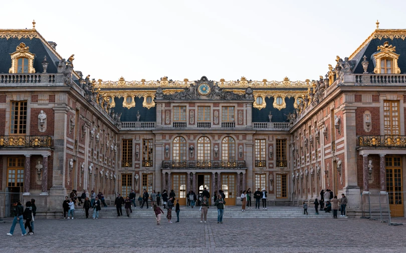 there are many people walking around the courtyard