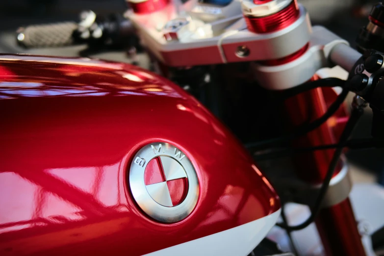 a close up of a red motorcycle's engine and handle bars