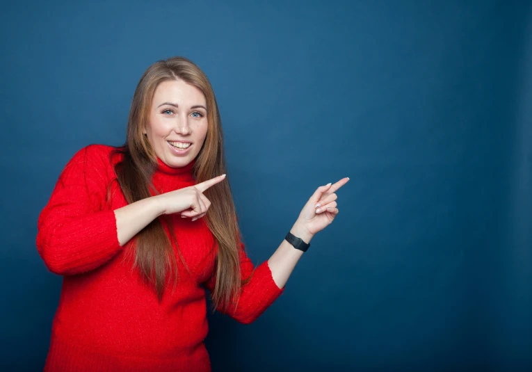 a woman standing up and making a gesture