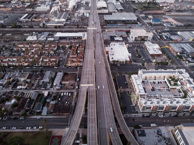 an overhead view of street construction near large city buildings