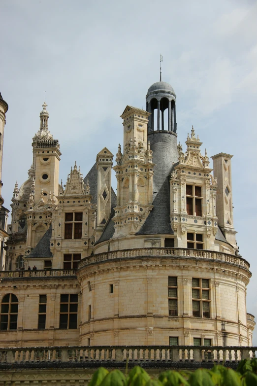 large brown building with lots of windows and a clock tower