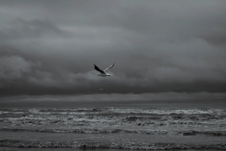 an airplane is flying over a rough ocean