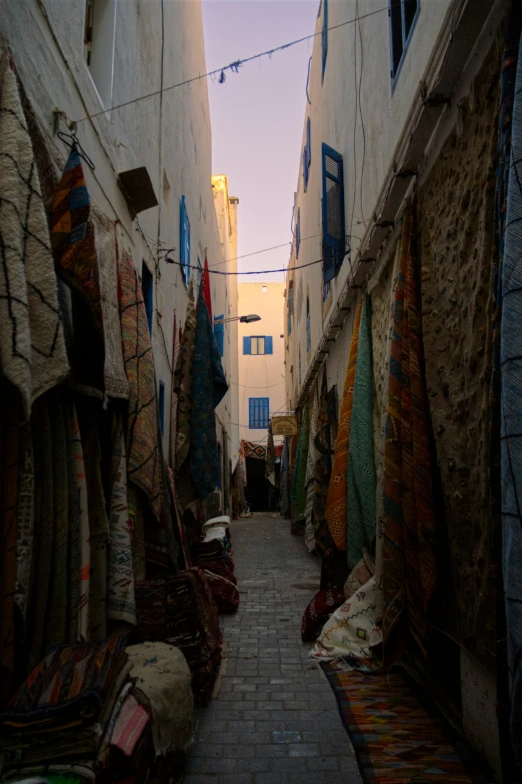 alleyway of small buildings in ancient town at sunset