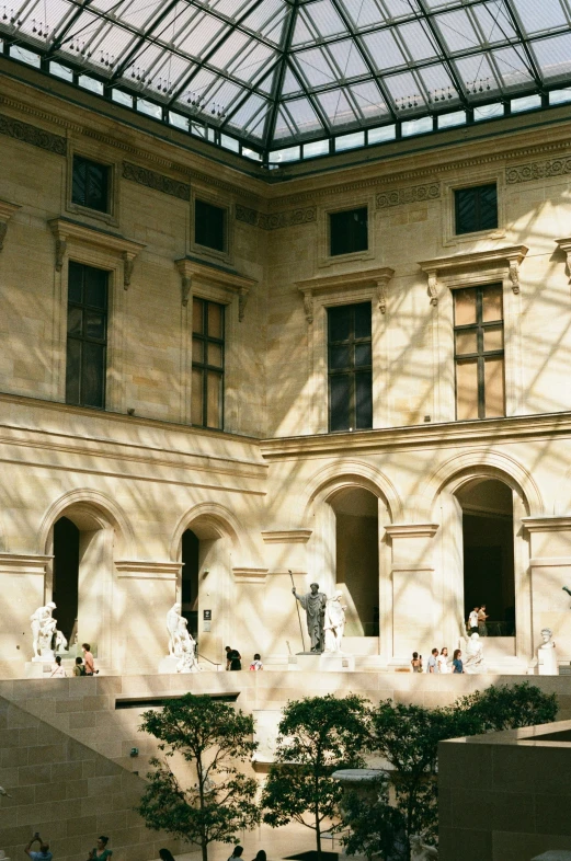 a large indoor courtyard area with statues inside