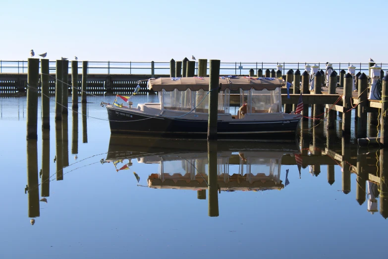 two small boats are parked in the water