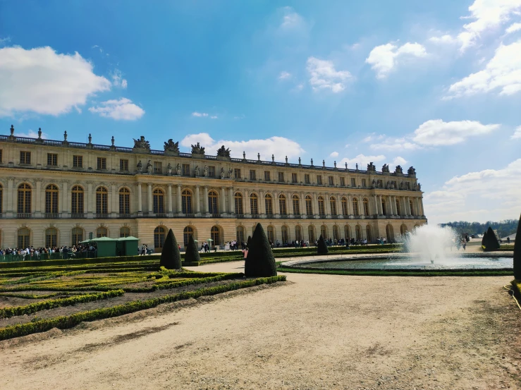 a large building with a fountain in the middle