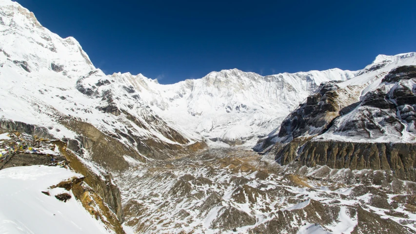 the view from a height high up of a snow covered mountain