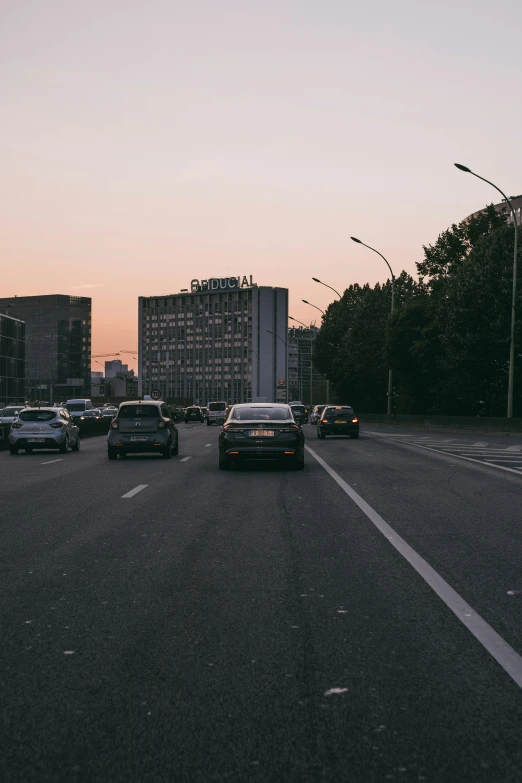 a car is riding down the middle of a road