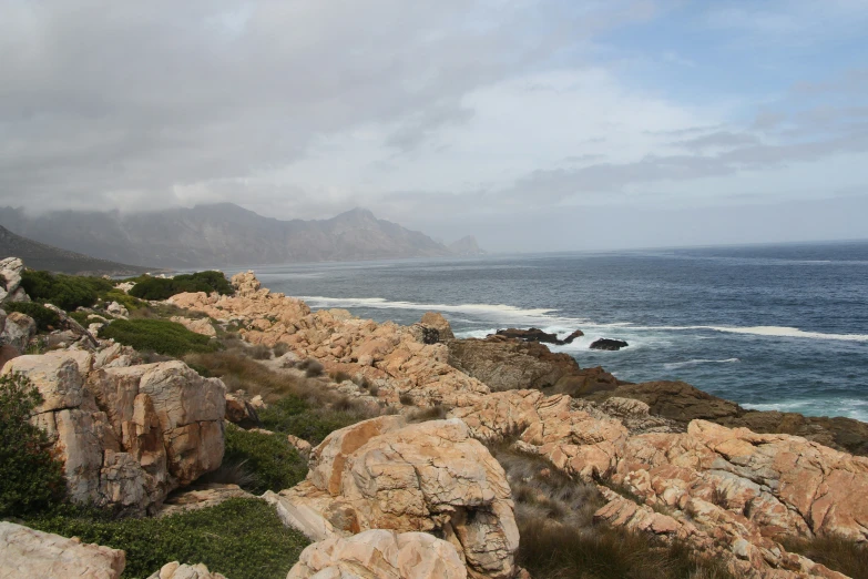 view from the cliffs to the ocean, mountains and land