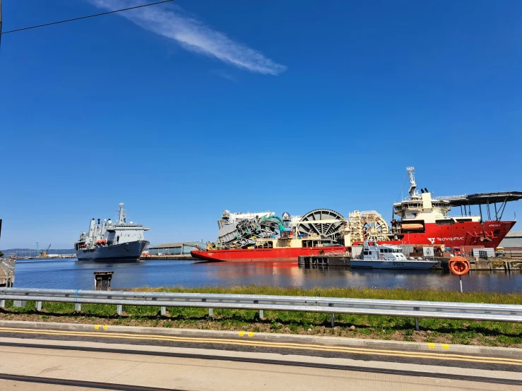 a river that has two large boats parked by it