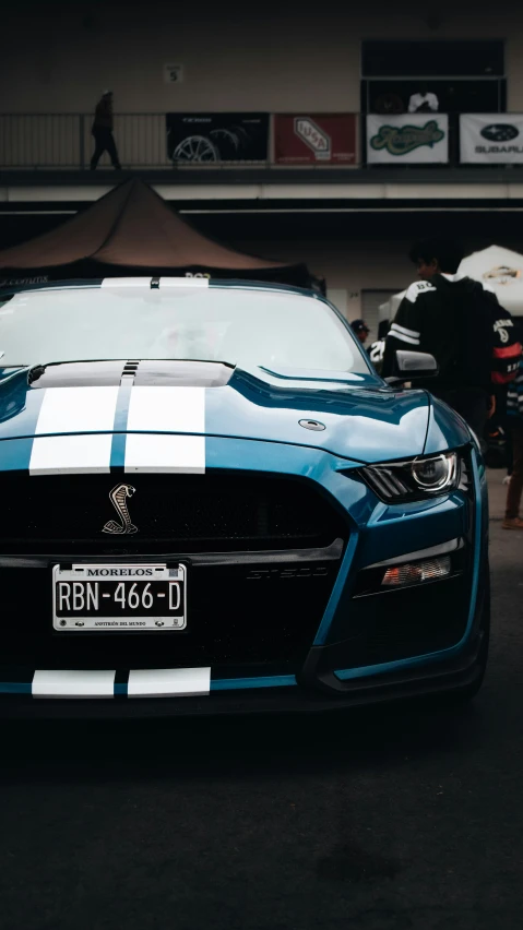 the front of a racing car at a race track