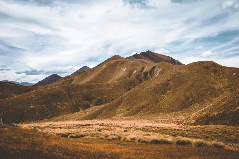 a man standing on a mountain overlooking mountains