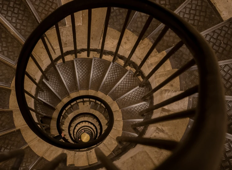 an upward view of a spiral staircase