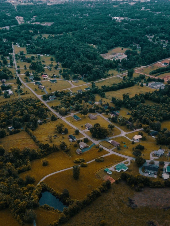 an aerial s shows a small village in the distance