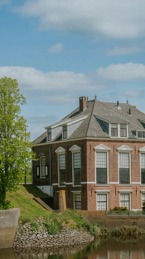 an old brick building with a water hole in front of it