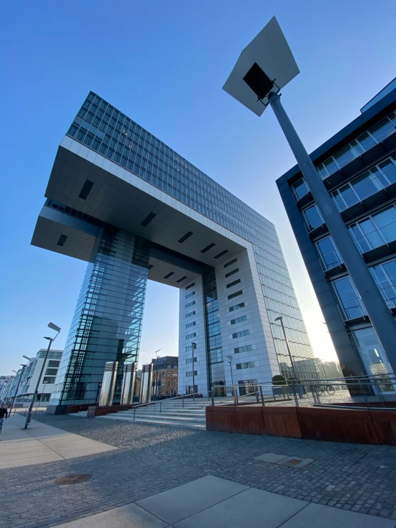 this is a very tall building in front of some buildings