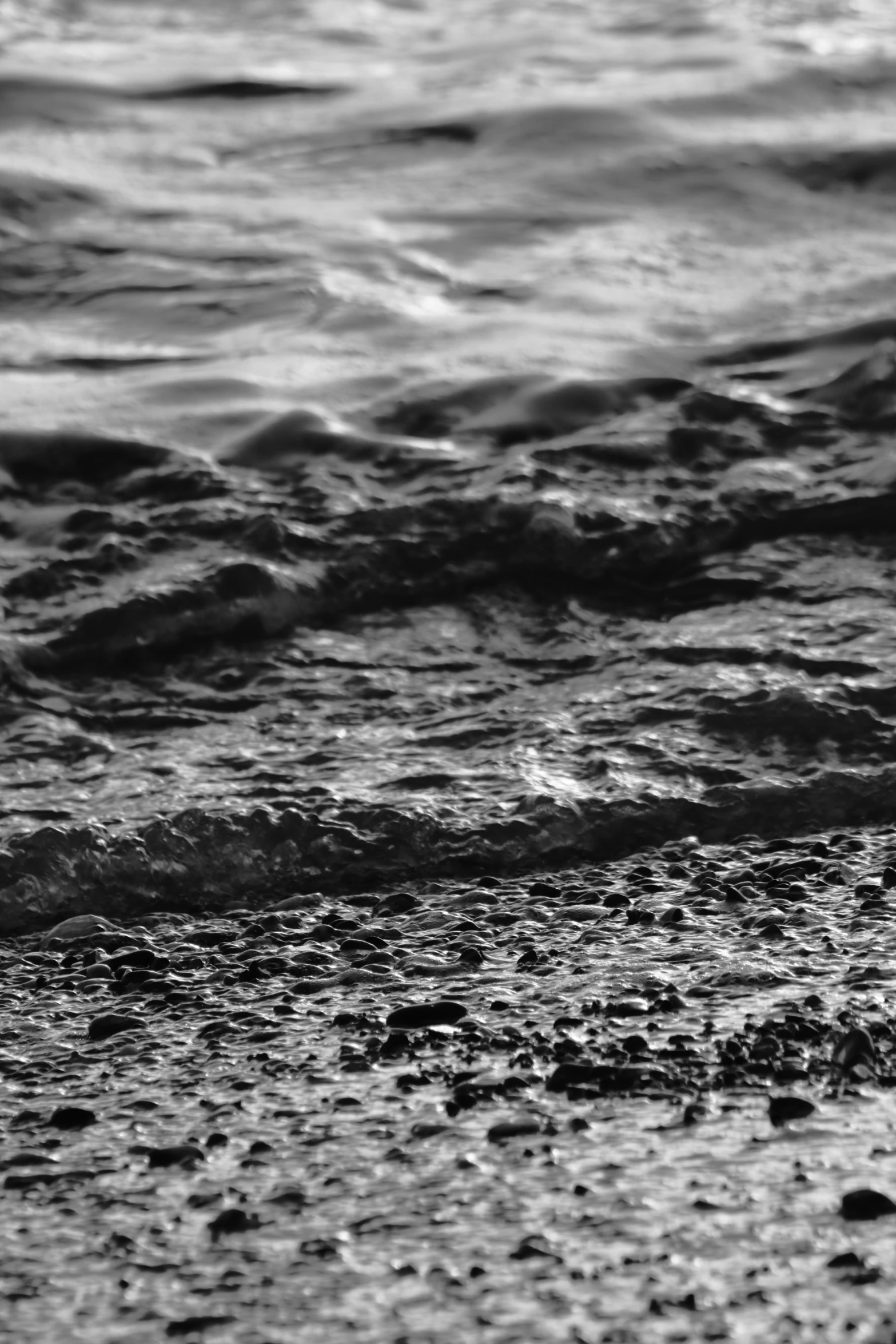 the sea waves can be seen coming in to shore