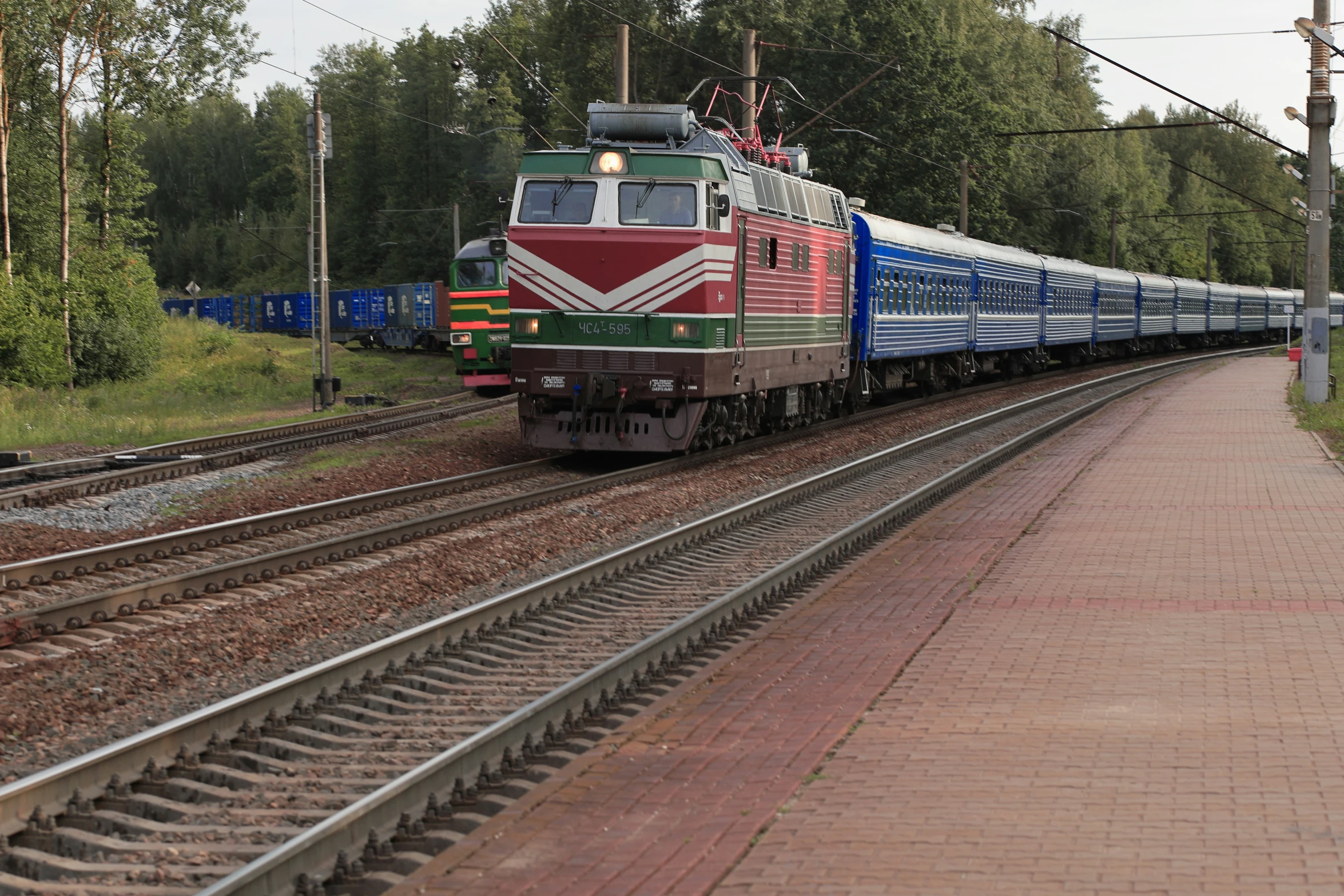 a train travels down a track in the country