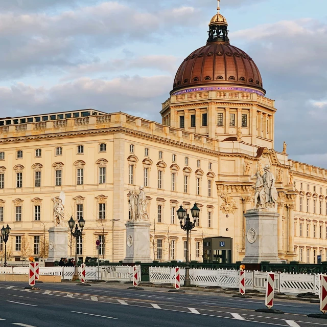 an old looking building is pictured on a cloudy day