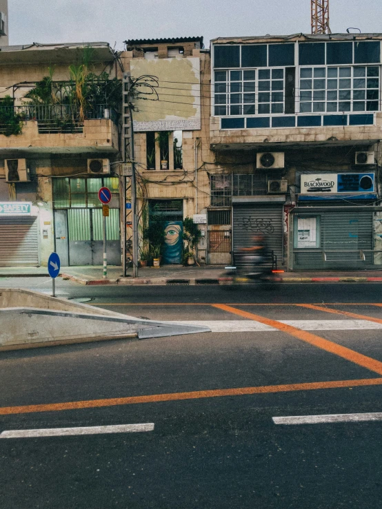 the corner of an intersection with buildings near it