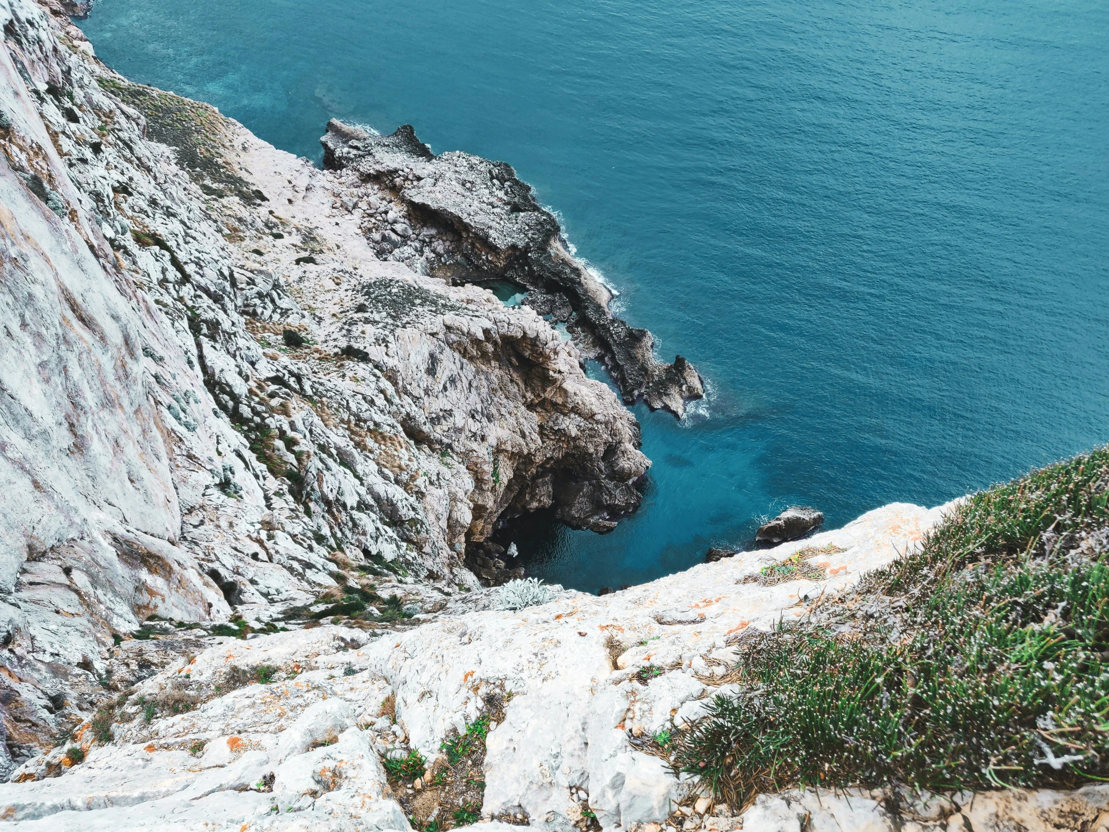 a view from above of some rocks and water