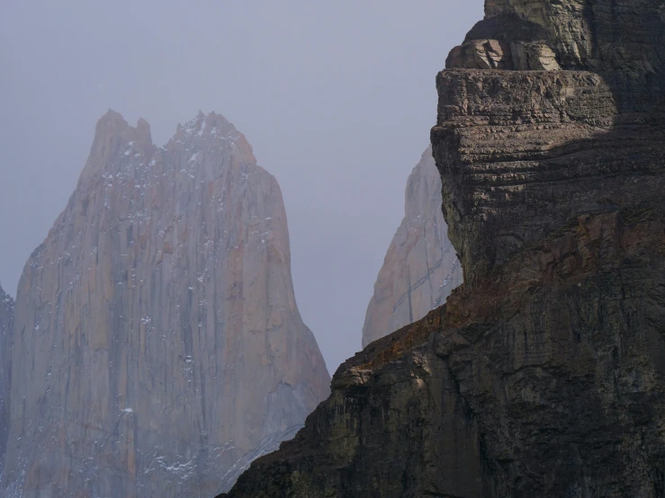 a large mountain is covered in snow and ice