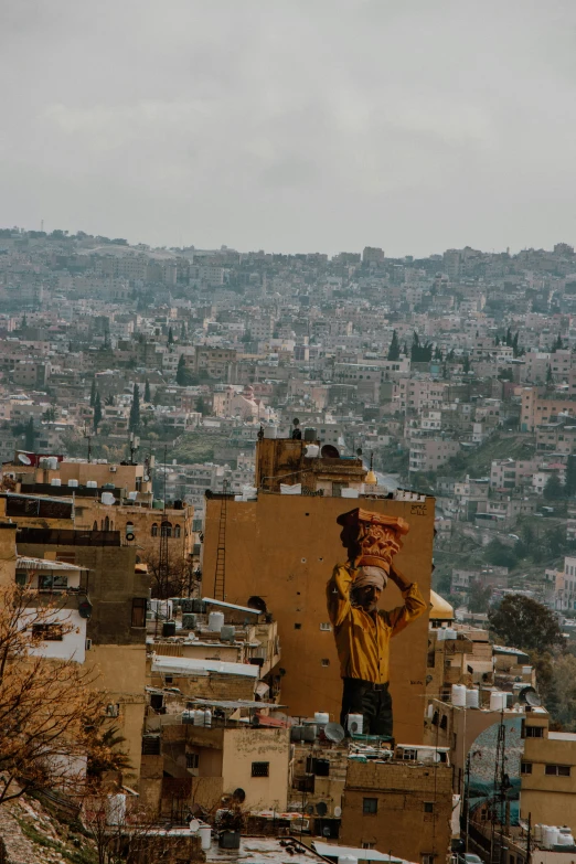 a person carrying soing in his hands from the sky above the city