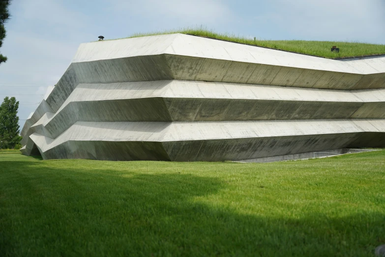 an unusual and modern concrete sculpture that looks to be on display