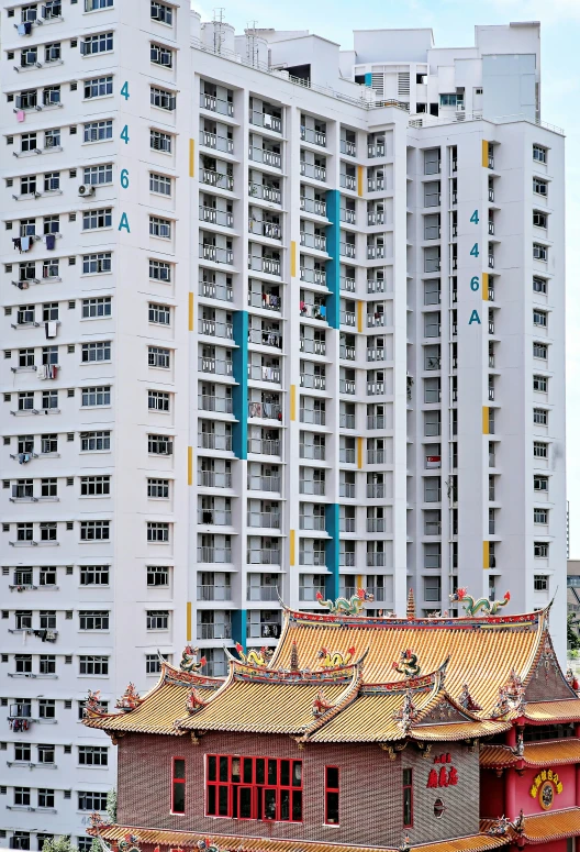 a chinese house in the foreground and buildings in the background