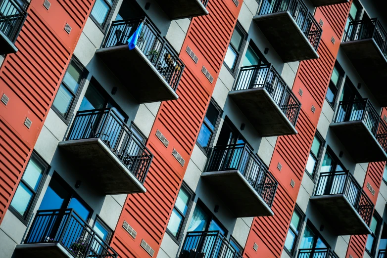 many balconies and windows on a building