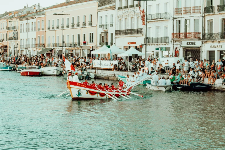 a boat with four oars is on the water