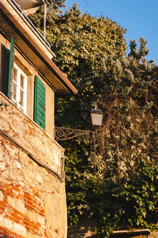 old style light and window on brick building