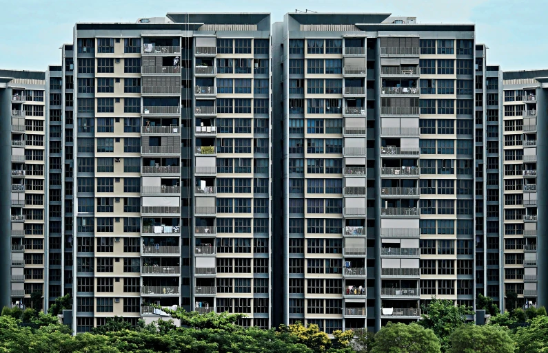 a large building with many windows has multiple balconies