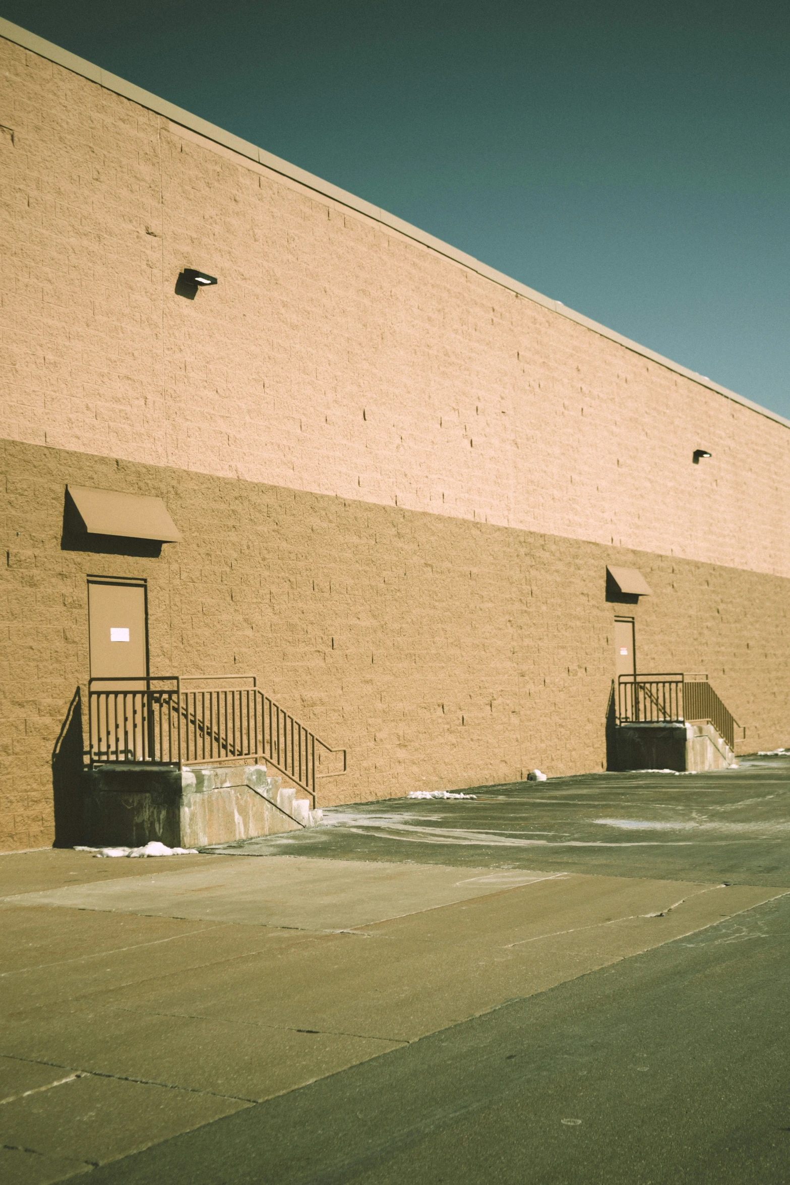 a brick building with a fire hydrant on the corner