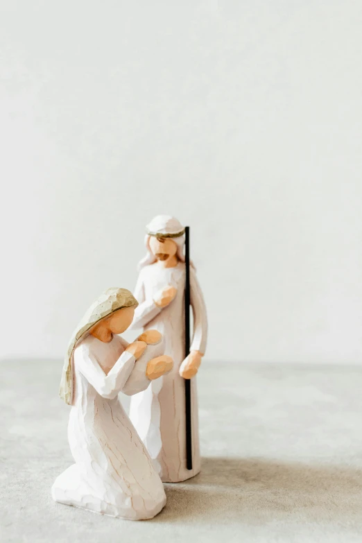 this figurine is depicting two persons playing a game of chess