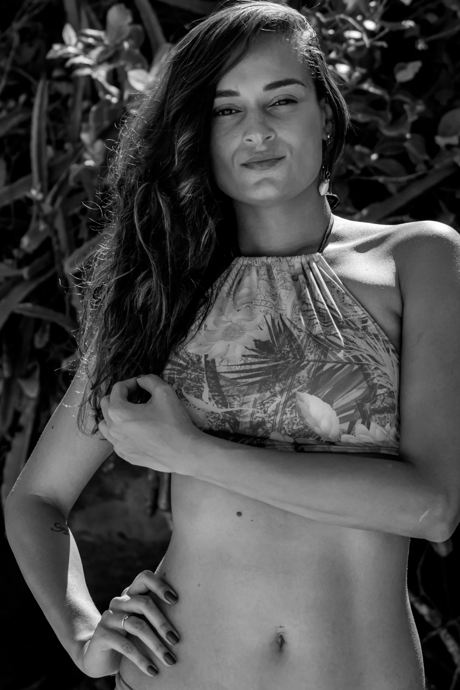 a woman posing for a picture in a bikini