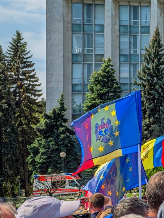 there are people on the street holding flags