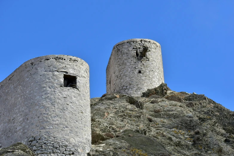 a stone castle sitting on top of a hill